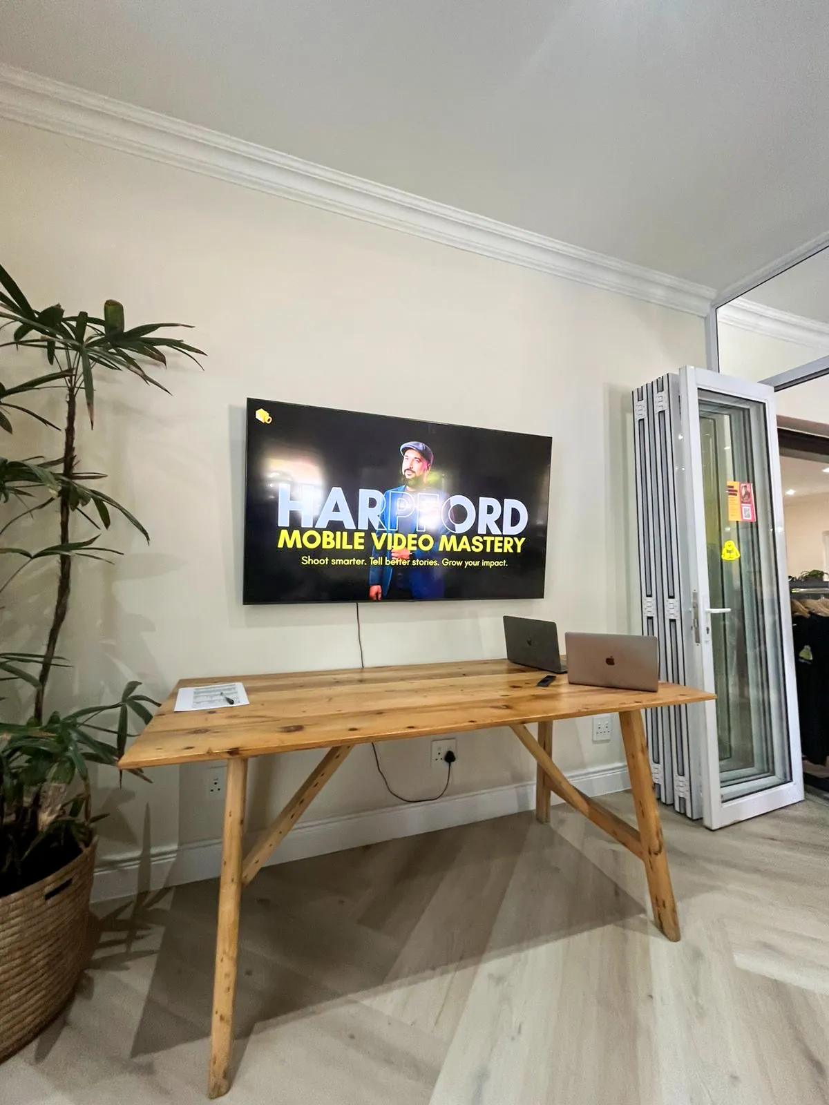 Workshop room set up with the Harpford Mobile Video Mastery title slide on screen