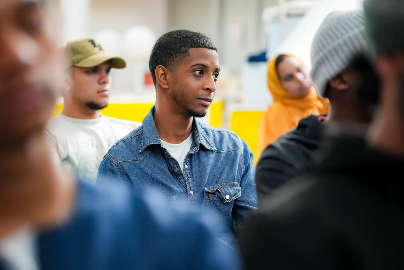 An attendee listening closely during a workshop session